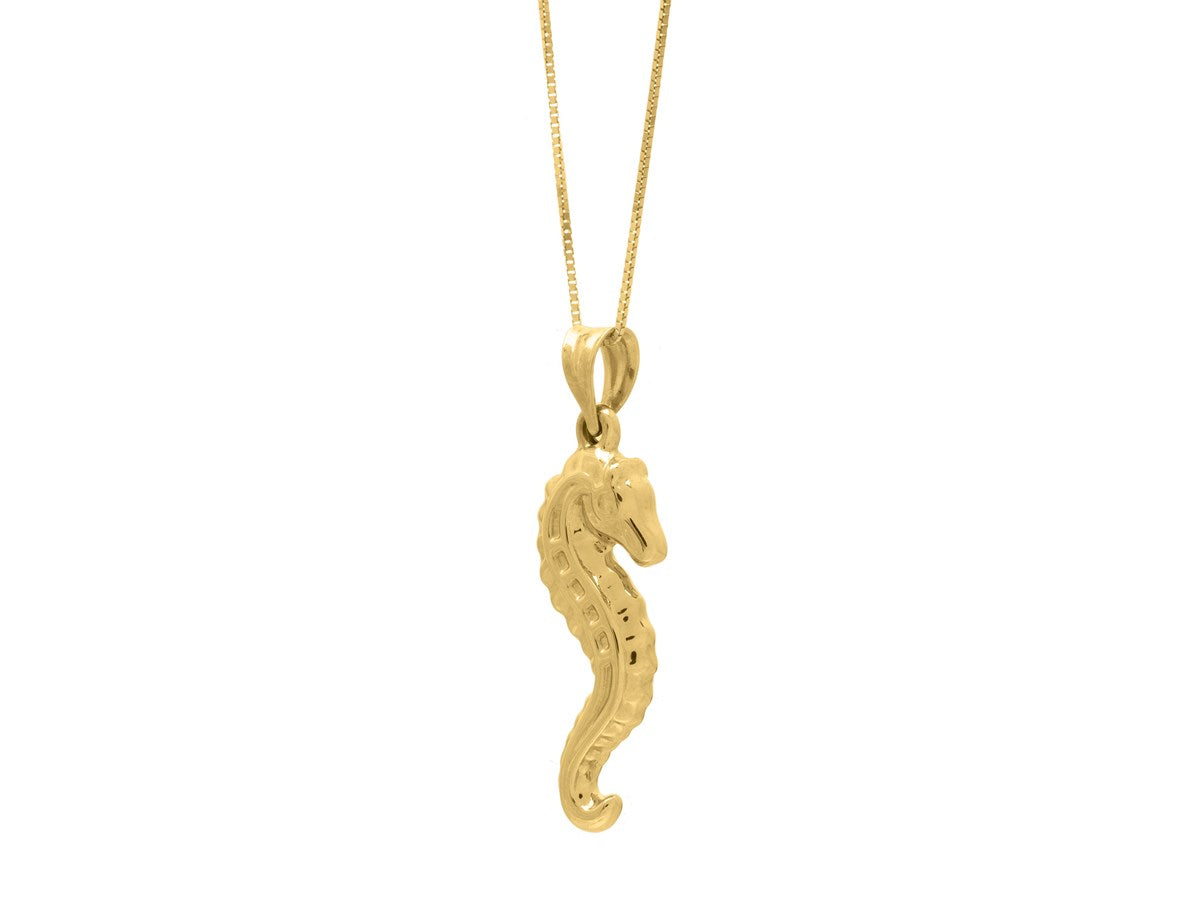 Close-up view of a stunning 10K gold seahorse necklace hanging from a delicate chain, showcasing its elegant design and intricate details.